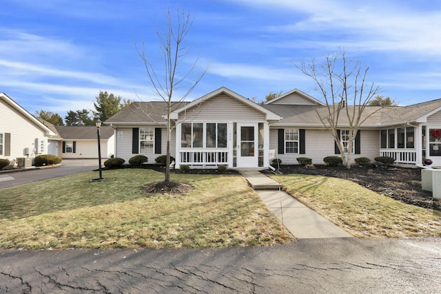 ranch-style home featuring a front yard