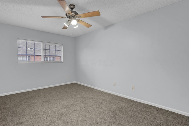 spare room with baseboards, a textured ceiling, and carpet flooring