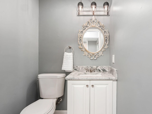 half bath with toilet and vanity