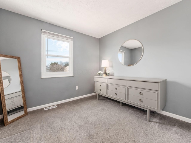 bathroom featuring visible vents, a textured ceiling, vanity, and baseboards