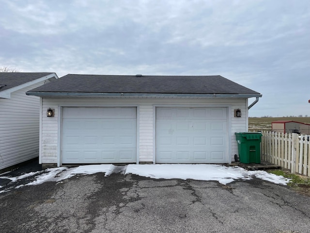 garage featuring fence