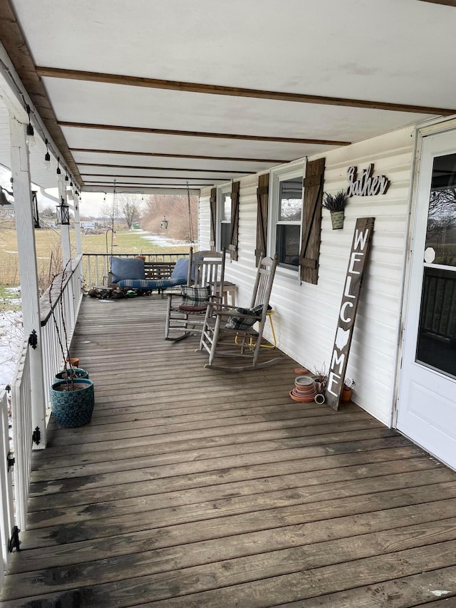 wooden deck featuring covered porch