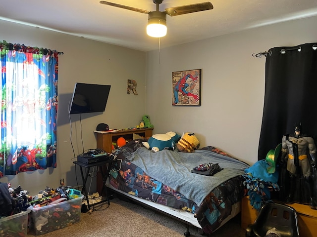 bedroom featuring carpet and a ceiling fan