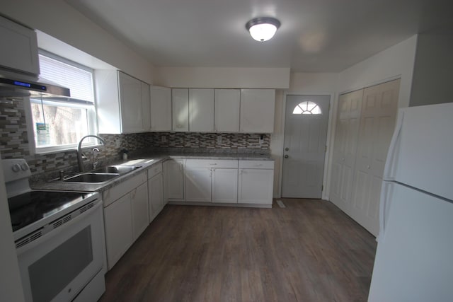 kitchen featuring dark wood-style floors, tasteful backsplash, white cabinetry, a sink, and white appliances