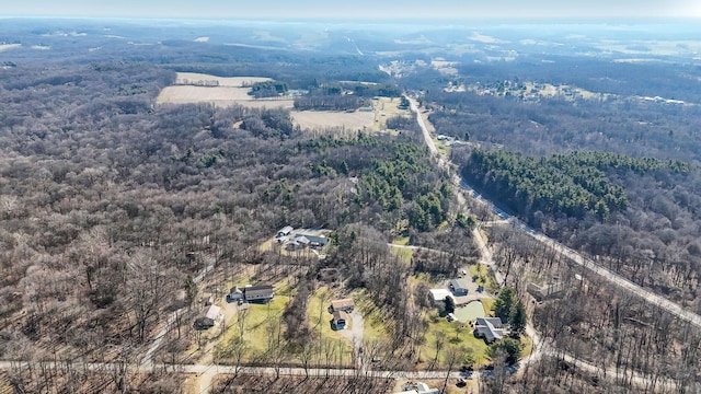 aerial view featuring a wooded view