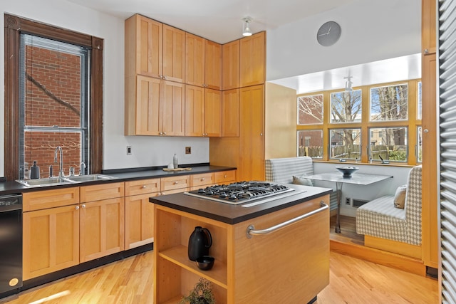 kitchen featuring black dishwasher, dark countertops, stainless steel gas stovetop, open shelves, and a sink