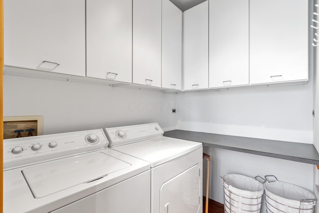 laundry room featuring washer and dryer and cabinet space