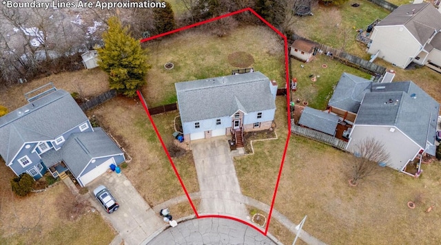 birds eye view of property with a residential view