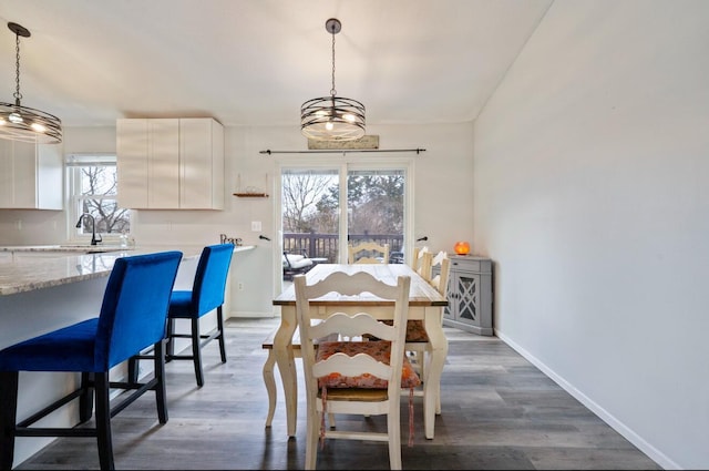 dining room with dark wood-style floors and baseboards