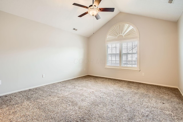 spare room with a ceiling fan, lofted ceiling, visible vents, and carpet