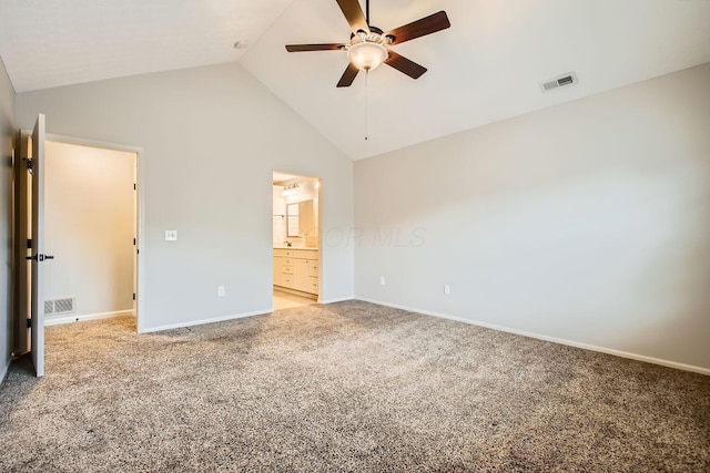 unfurnished bedroom with high vaulted ceiling, light colored carpet, visible vents, and baseboards