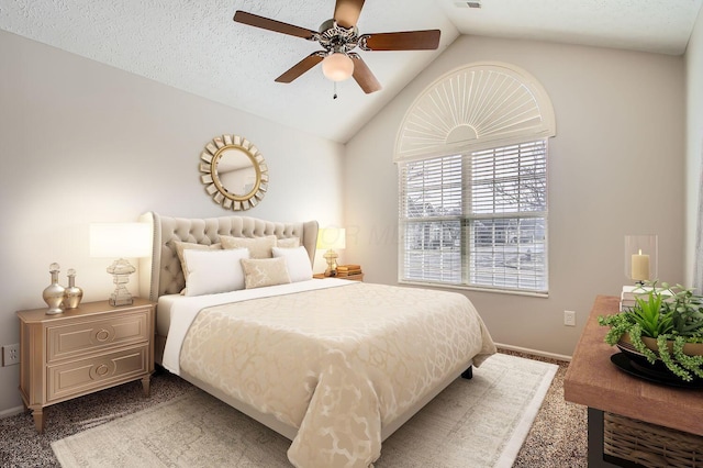 bedroom with lofted ceiling, ceiling fan, visible vents, and a textured ceiling