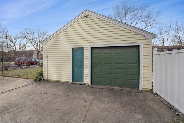 garage with fence