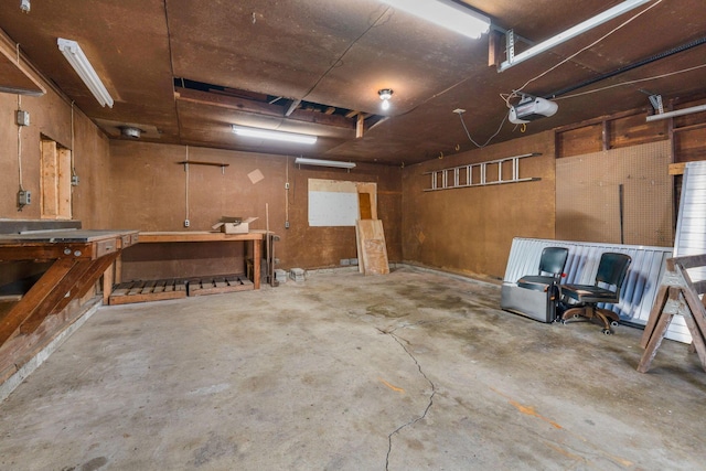 garage featuring a workshop area and a garage door opener