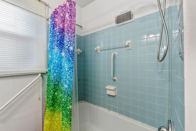 full bath with visible vents and bathing tub / shower combination