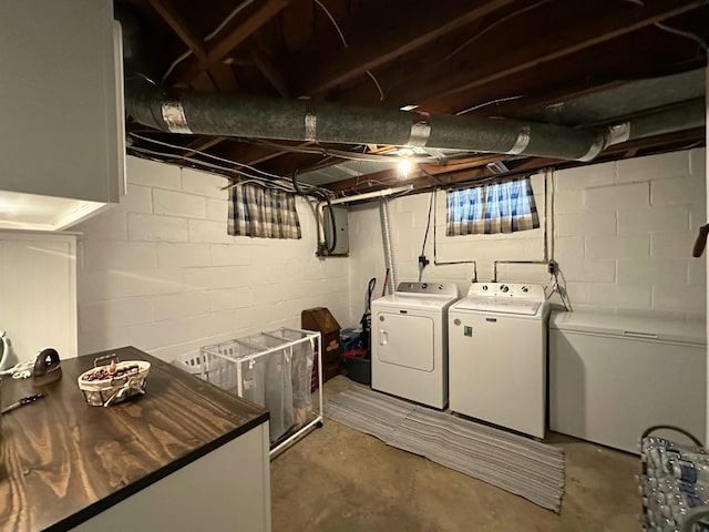 clothes washing area featuring laundry area and washing machine and clothes dryer