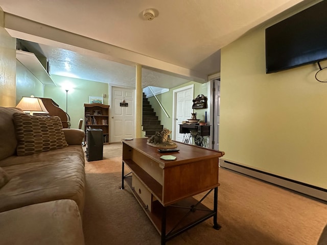 carpeted living room with stairs and a baseboard heating unit