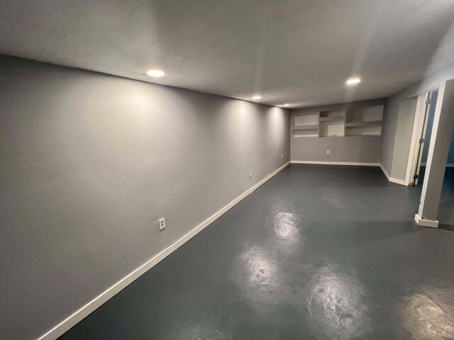 finished below grade area with recessed lighting and baseboards