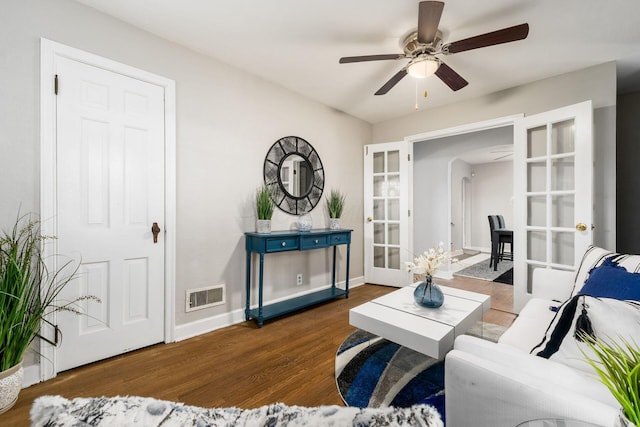 1724 E Livingston Ave, Columbus, OH 43205 - living room with ceiling fan, wood finished floors, arched walkways, french doors, and baseboards
