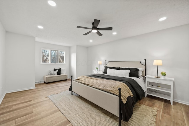 bedroom with light wood-type flooring and recessed lighting