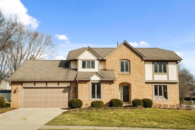 view of front facade featuring a chimney, a front lawn, and brick siding