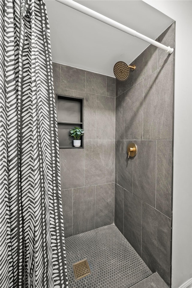 full bathroom with tiled shower