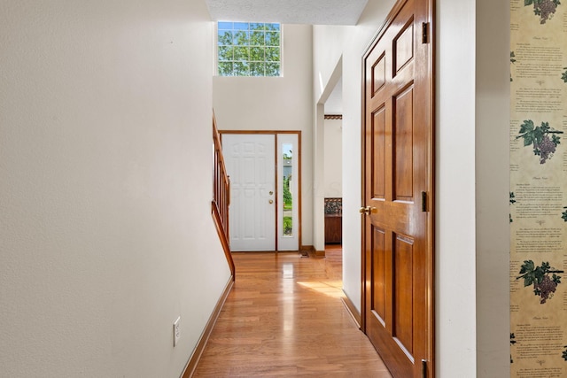6266 Misty Cove Ln, Columbus, OH 43231 - foyer entrance with light wood-type flooring, baseboards, and stairs