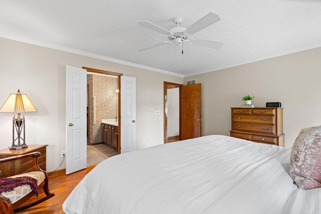 6266 Misty Cove Ln, Columbus, OH 43231 - bedroom featuring wood finished floors, ornamental molding, connected bathroom, and a ceiling fan