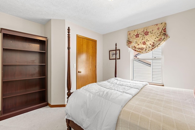 6266 Misty Cove Ln, Columbus, OH 43231 - bedroom with carpet, a textured ceiling, and baseboards