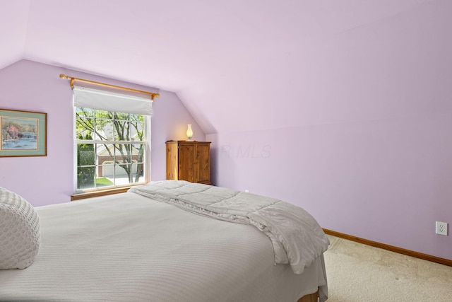 6266 Misty Cove Ln, Columbus, OH 43231 - carpeted bedroom with vaulted ceiling and baseboards