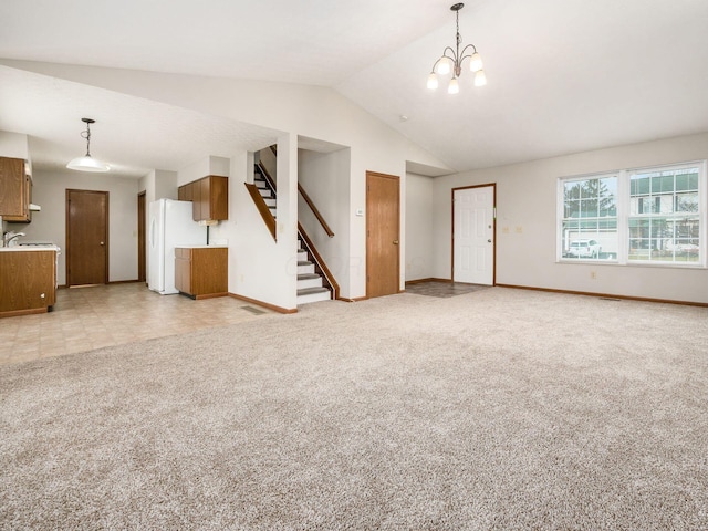 unfurnished living room featuring lofted ceiling, light carpet, baseboards, stairs, and an inviting chandelier