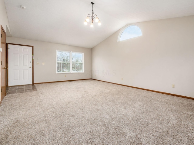 interior space with lofted ceiling, plenty of natural light, and carpet flooring