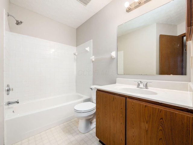 full bath with toilet, tub / shower combination, a textured ceiling, and vanity