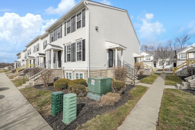 view of home's exterior with a residential view