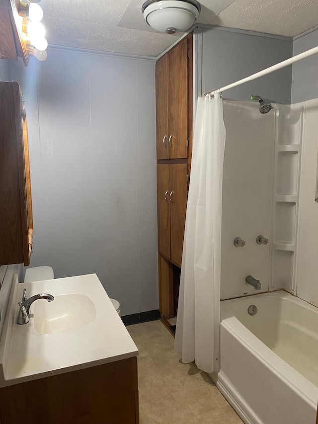 full bath with toilet, shower / tub combo with curtain, a textured ceiling, and vanity