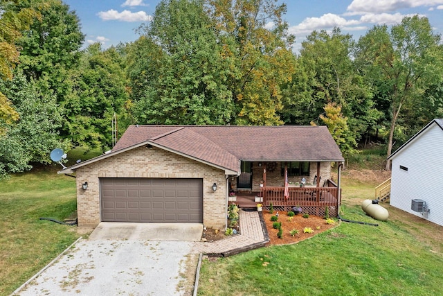 view of front of house featuring brick siding, a porch, a front yard, a garage, and driveway