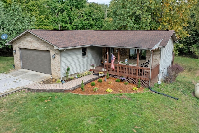 ranch-style home featuring brick siding, driveway, a front yard, and a garage