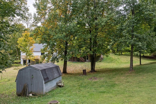 view of yard featuring an outbuilding and a shed