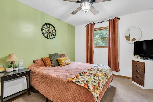 bedroom with baseboards, ceiling fan, and carpet floors