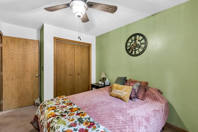 carpeted bedroom featuring a closet and ceiling fan