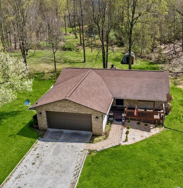 14580 Monroe Mills Rd, Mount Vernon, OH 43050 - view of front of home featuring a front lawn, a porch, brick siding, a shingled roof, and gravel driveway
