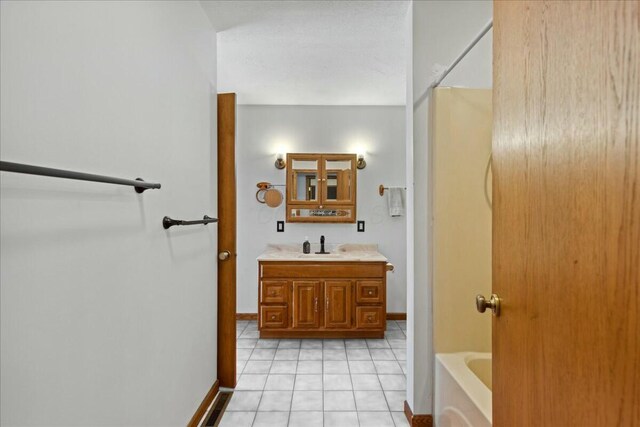 14580 Monroe Mills Rd, Mount Vernon, OH 43050 - bathroom featuring baseboards, tile patterned flooring, and vanity