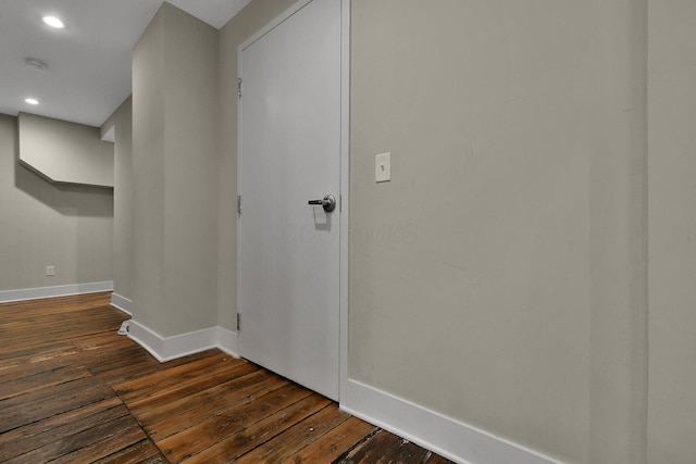 interior space with baseboards, dark wood finished floors, and recessed lighting