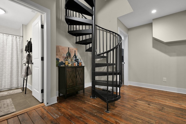 stairs featuring recessed lighting, wood-type flooring, and baseboards