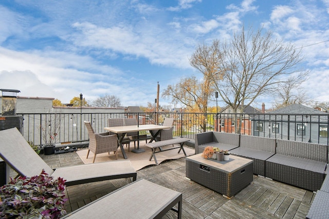 deck featuring outdoor dining space and an outdoor hangout area