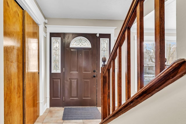 entryway with light tile patterned flooring