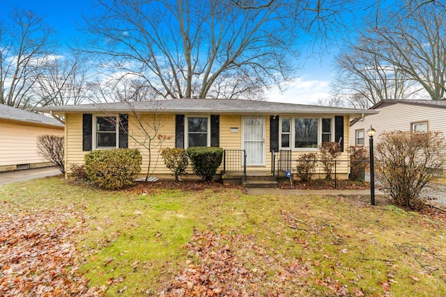 single story home featuring a front yard