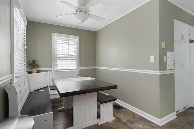 office area with baseboards, ceiling fan, visible vents, and crown molding