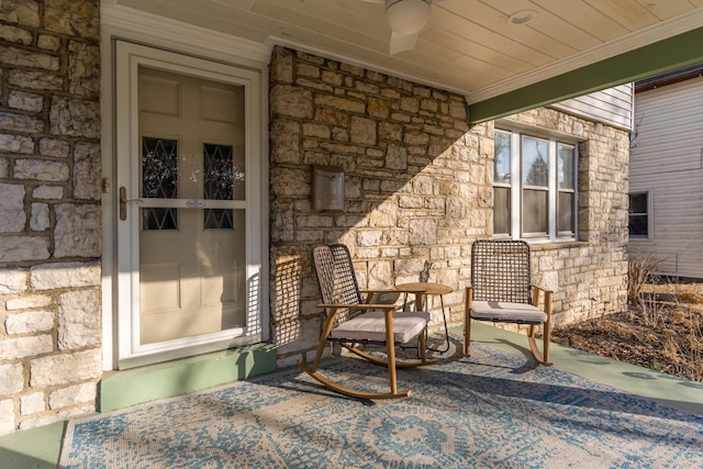 view of exterior entry featuring stone siding