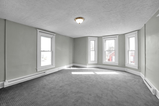 unfurnished room featuring carpet floors, a baseboard radiator, baseboards, and a textured ceiling